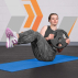 Female athlete performing core exercise with 10kg plate