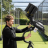 Bowling Machine head tilts forward and back to adjust length of deliveries
