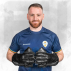 Wicketkeeper wearing black leather gloves