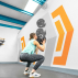 Female athlete exercising with wall ball