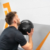Male athlete exercising with wall ball