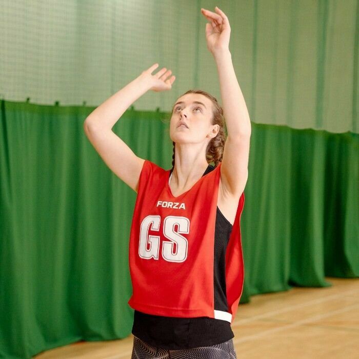 brightly coloured netball bibs