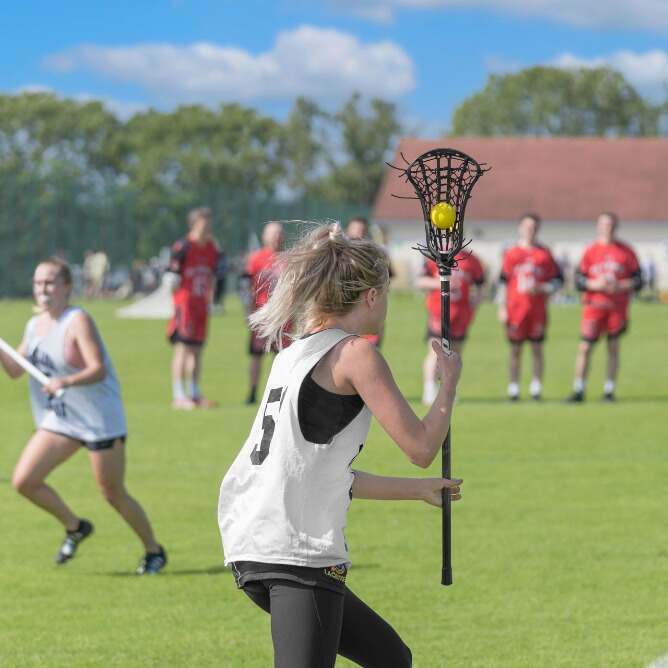 woman playing lacrosse