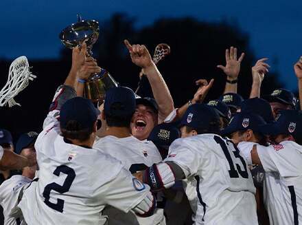 USA team lifting lacrosse trophy